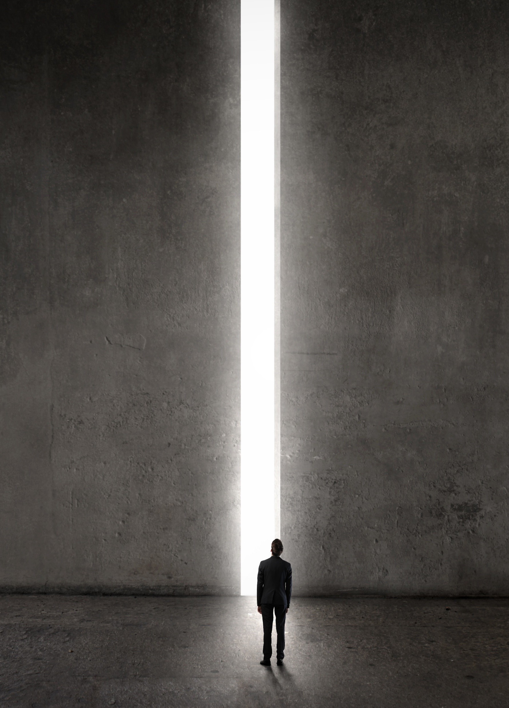 A figure facing a threshold of light